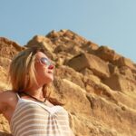 beautiful tourist woman watching sun