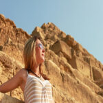 beautiful tourist woman watching sun 1